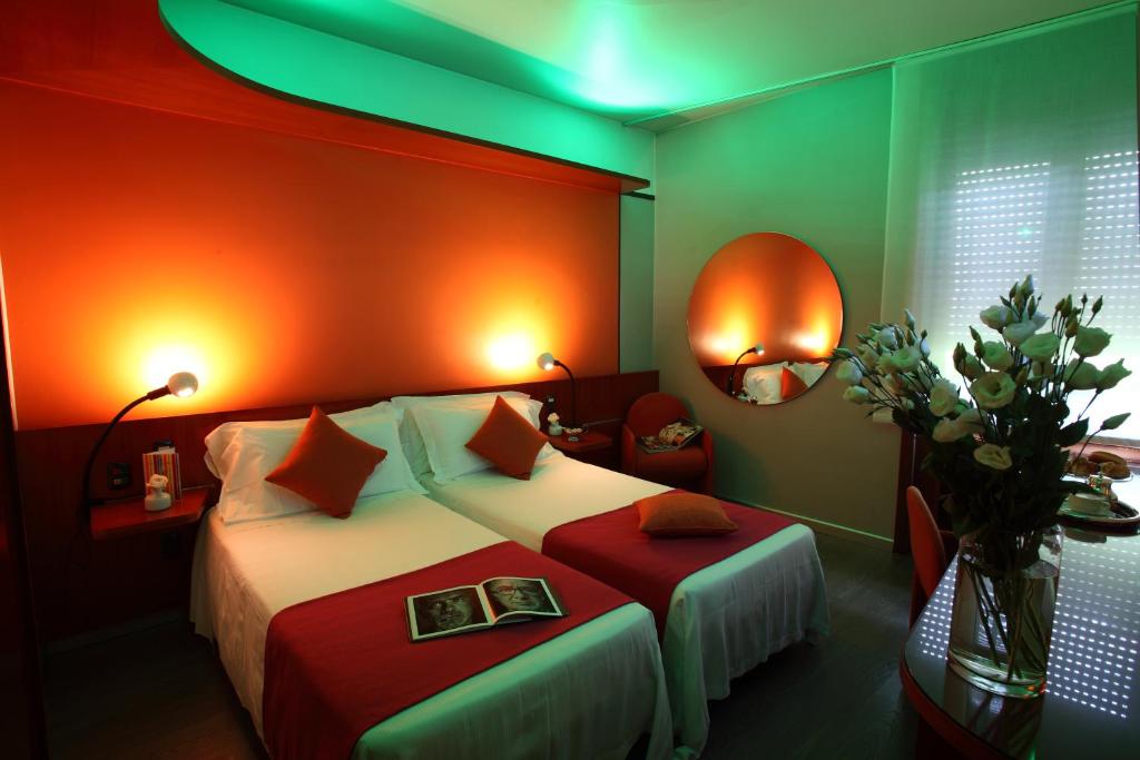 Postel nebo postele na pokoji v ubytování Hotel Mediolanum
