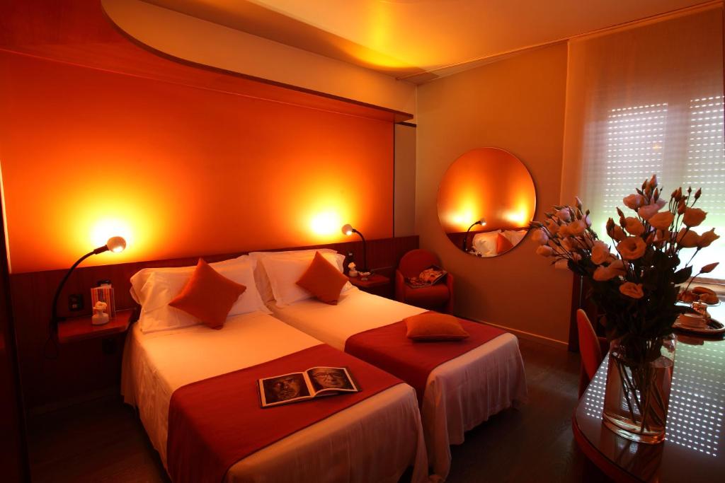 Postel nebo postele na pokoji v ubytování Hotel Mediolanum