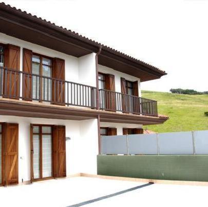 a building with a balcony on the side of it at Apartamentos Turisticos Talaimendi in Zarautz