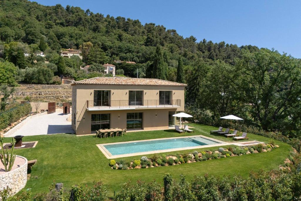 an external view of a house with a swimming pool at Villa Maynaya in Vence
