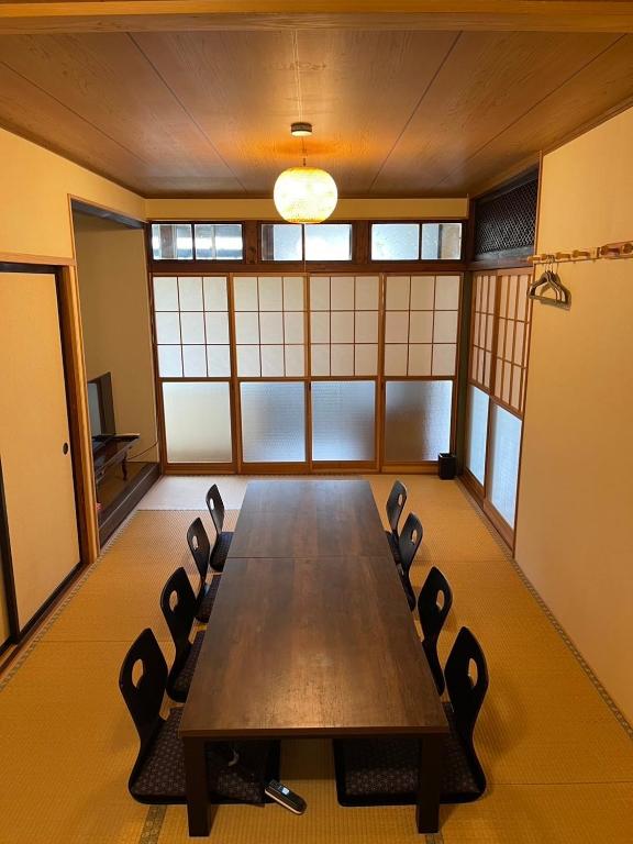 a conference room with a long table and chairs at Huis Tashiro in Yuzawa