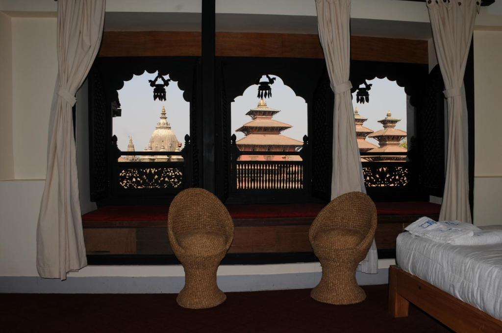 Voodi või voodid majutusasutuse Lalit Heritage Home toas