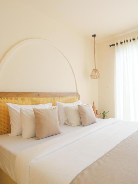 En eller flere senge i et værelse på Samudra Ahangama