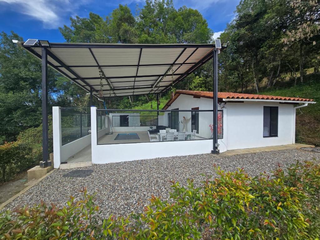 a pavilion with a view of a house at Manawa Kaona in Somondoco