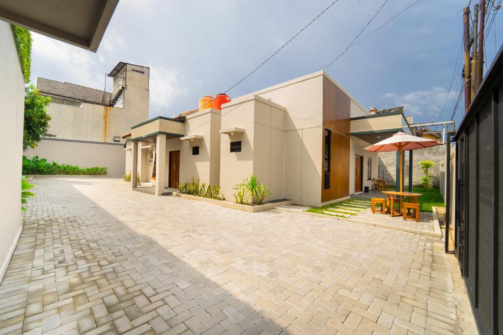 a courtyard of a house with a patio at Semenrante Living By ARBA in Solo