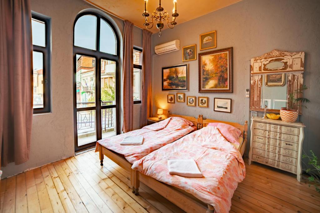 En eller flere senge i et værelse på Guest House Malkia Inter