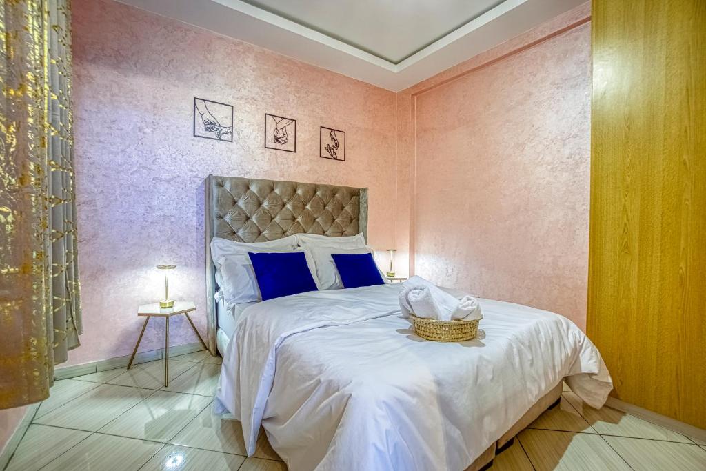 a bedroom with a bed with a basket on it at Appartement saada Agadir in Agadir