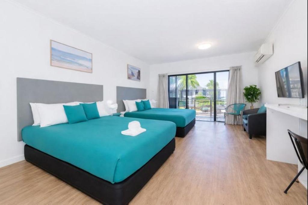 Postel nebo postele na pokoji v ubytování Perfect Position for City and Stadium Access Townsville