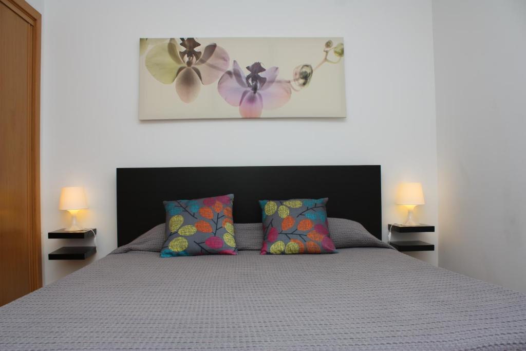 En eller flere senge i et værelse på Apartamento Mar e Serra