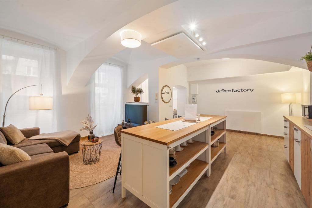 a living room with a table and a couch at dreamfactory Residence - Eastside in Vienna