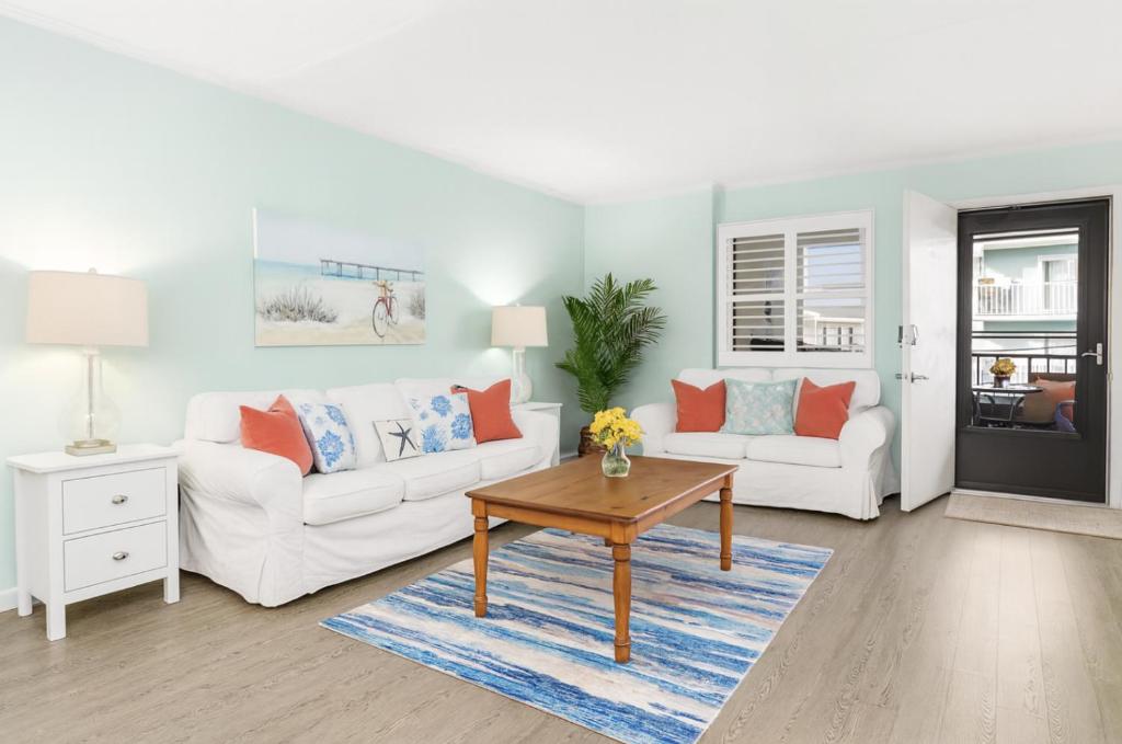 a living room with two white couches and a table at Late August Labor Day Deals! Ocean Block Sleeps 6 Beach Gear in Ocean City