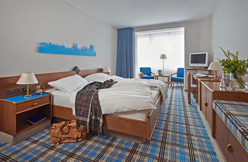 Postel nebo postele na pokoji v ubytování Seaside Residenz Hotel Chemnitz