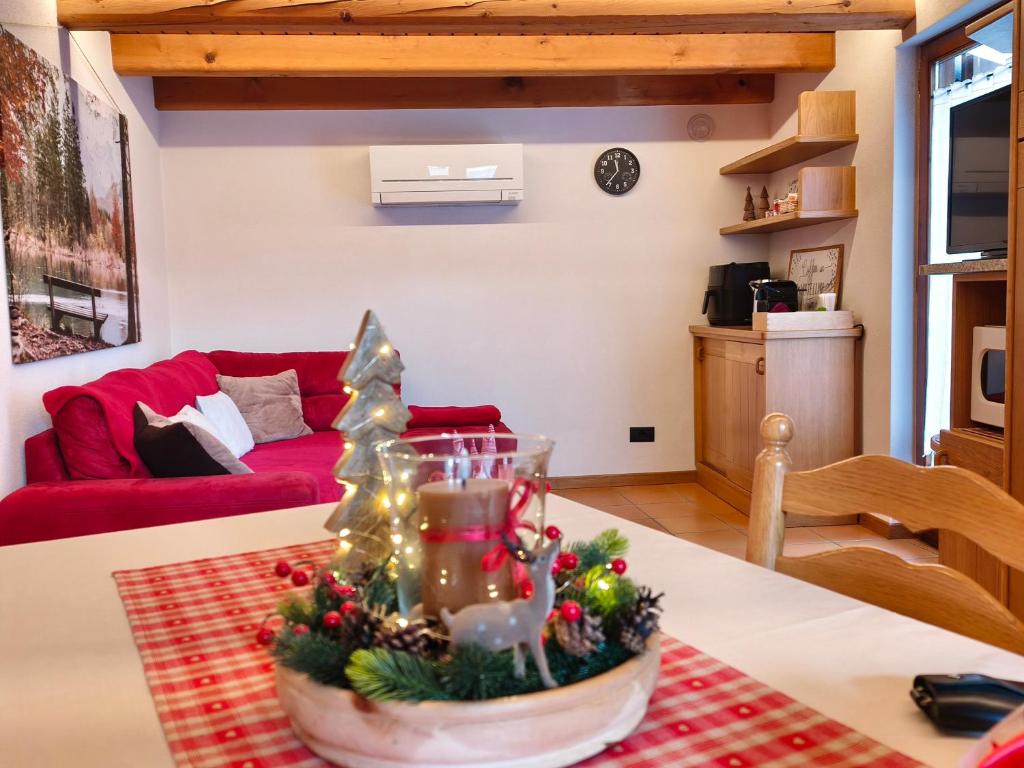 a living room with a christmas tree on a table at Baitin Laf in Grosio
