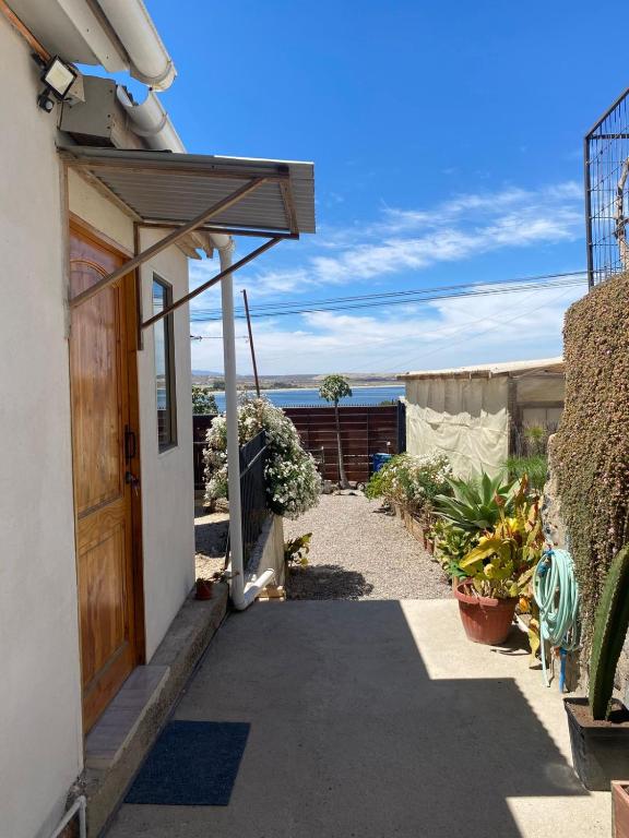 a pathway leading to a house with a door at Loft Tongoy 3 Peninsula in Coquimbo