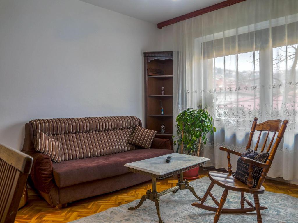 a living room with a couch and a table at Apartment Bistrik mahala in Sarajevo