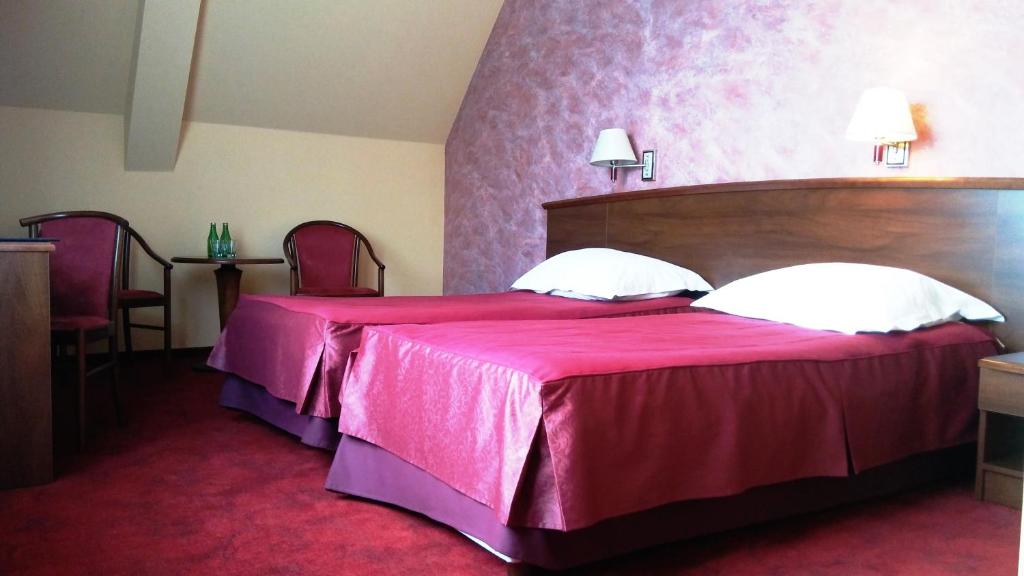 Postel nebo postele na pokoji v ubytování Hotel Zawiercie