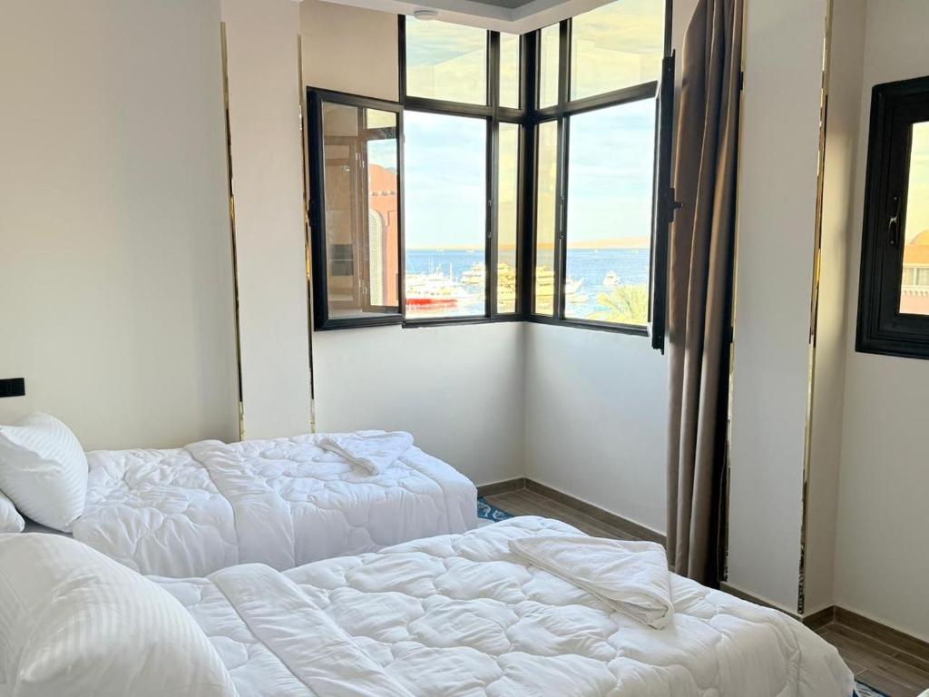 Giường trong phòng chung tại VERO Residence