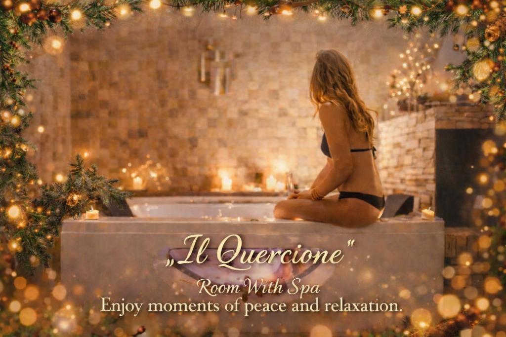 a woman in a bathing suit sitting in a bath tub at "Il Quercione" Room With SpA in Lama Di Peligni