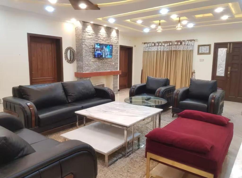 Et opholdsområde på Cottage In Changla Gali - Secluded, Cozy Stay