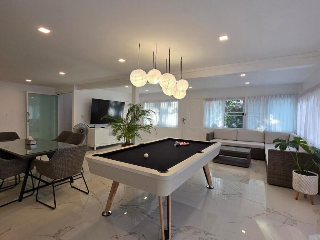 a large living room with a pool table in it at Sunset Beach Villa 30m to Beach 4BR in North Pattaya