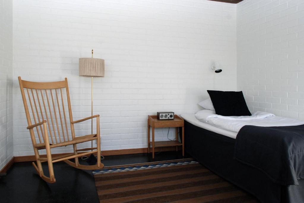Postel nebo postele na pokoji v ubytování Ekebacken Hotell & Konferens