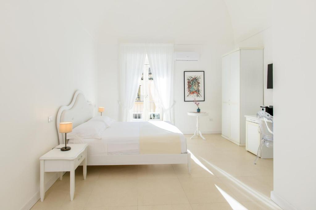 Postel nebo postele na pokoji v ubytování Dimora Margherita