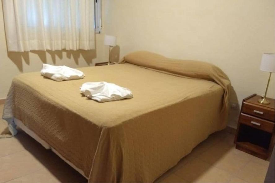 En eller flere senge i et værelse på Hotel vacacional Sierras de cordoba