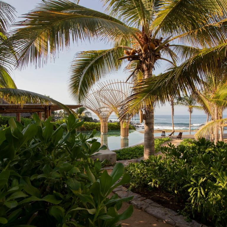 a view of the beach from the resort at Perfect Hideaway for Two-GroundFloor in La Majahua