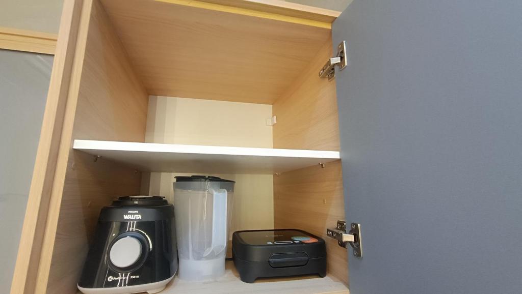 Køkken eller tekøkken på Studio moderno no centro de São Lourenço Avenida Principal