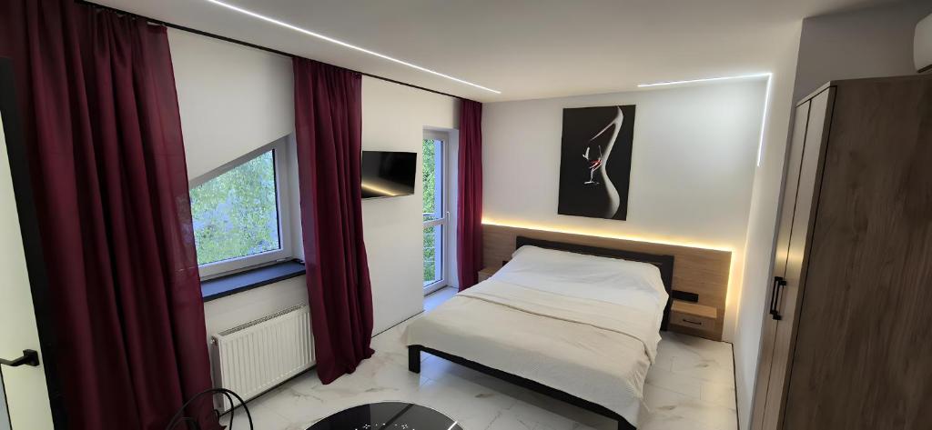 En eller flere senge i et værelse på Afina center apartment