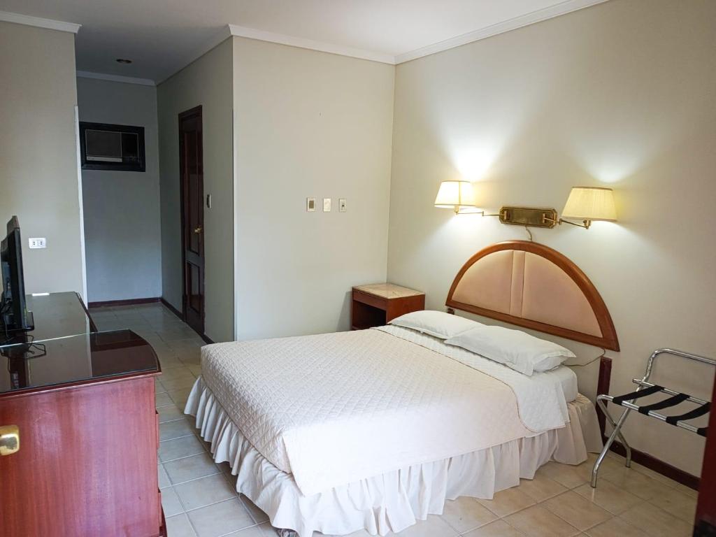 Postel nebo postele na pokoji v ubytování Hotel ASTURIAS BOUTIQUE