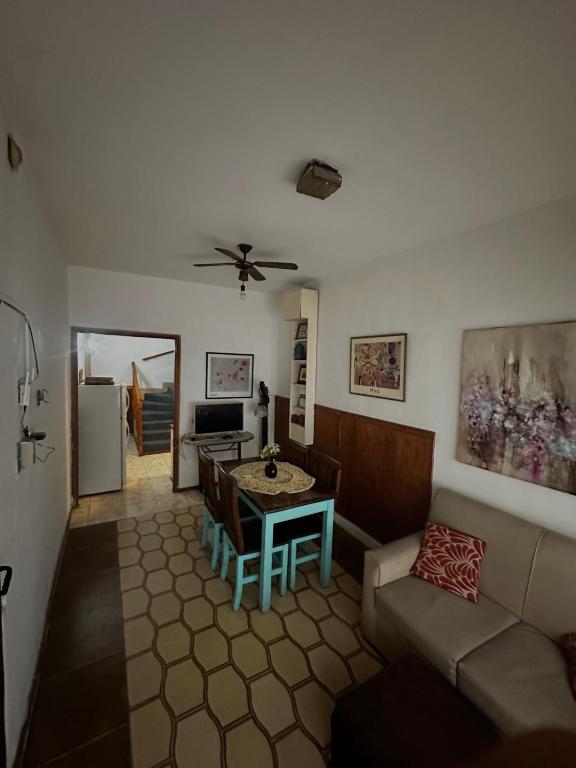 a living room with a couch and a table at Departamento Mi Casa in La Porteña