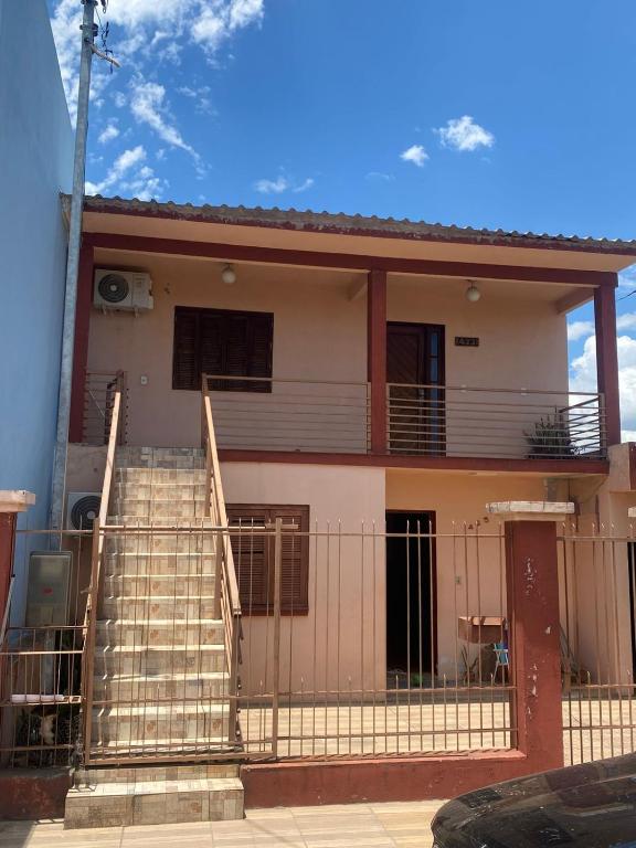 a house with stairs in front of it at pousada cardoso - casa 2 in São Gabriel