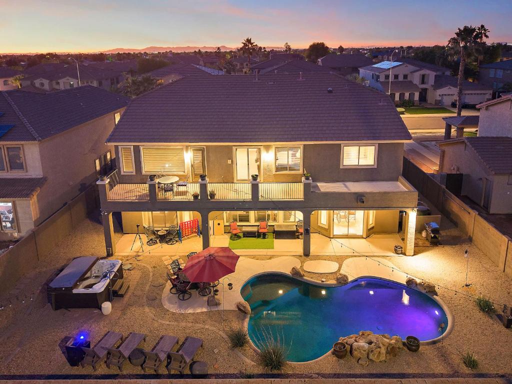 an aerial view of a house with a swimming pool at Sleeps 14 Pool Fire Pit Billiards EV Plug in Mesa