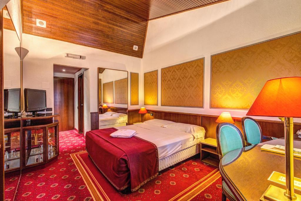 Postel nebo postele na pokoji v ubytování Hotel Motel Regal