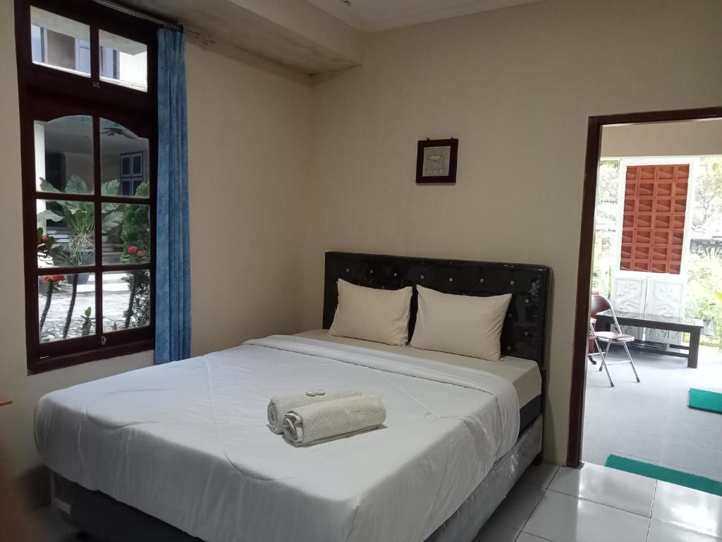 Giường trong phòng chung tại Pakemsari Resort Hotel