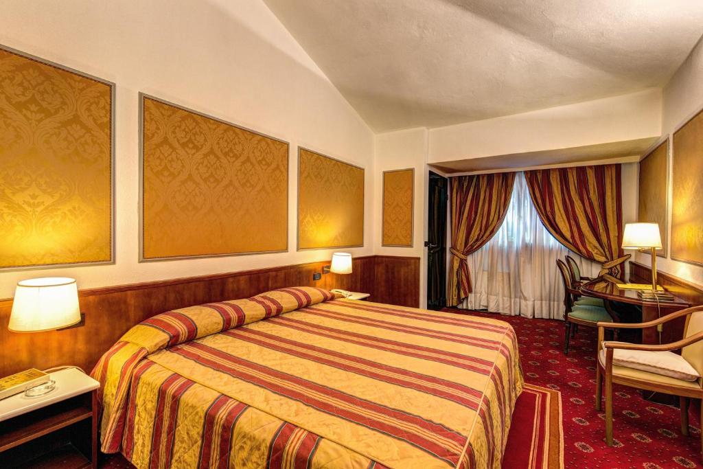 Postel nebo postele na pokoji v ubytování Hotel Motel Regal