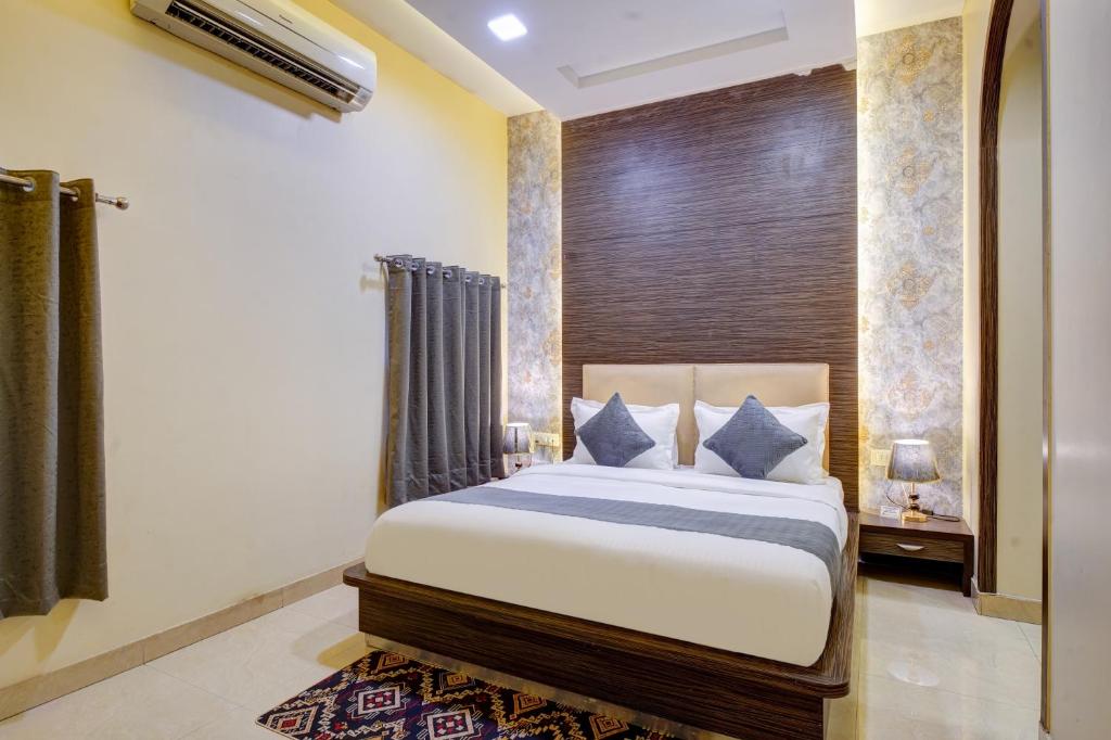 Ένα ή περισσότερα κρεβάτια σε δωμάτιο στο Shyama inn by Rivlet