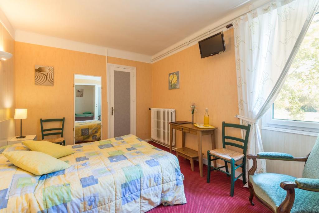 Voodi või voodid majutusasutuse Hôtel du Val d'Aure toas