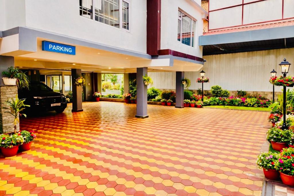 an empty lobby of a hotel with a parking lot at The Grand - A Premium Hotel near new BUS STAND SIMLA- Centrally heated in Shimla