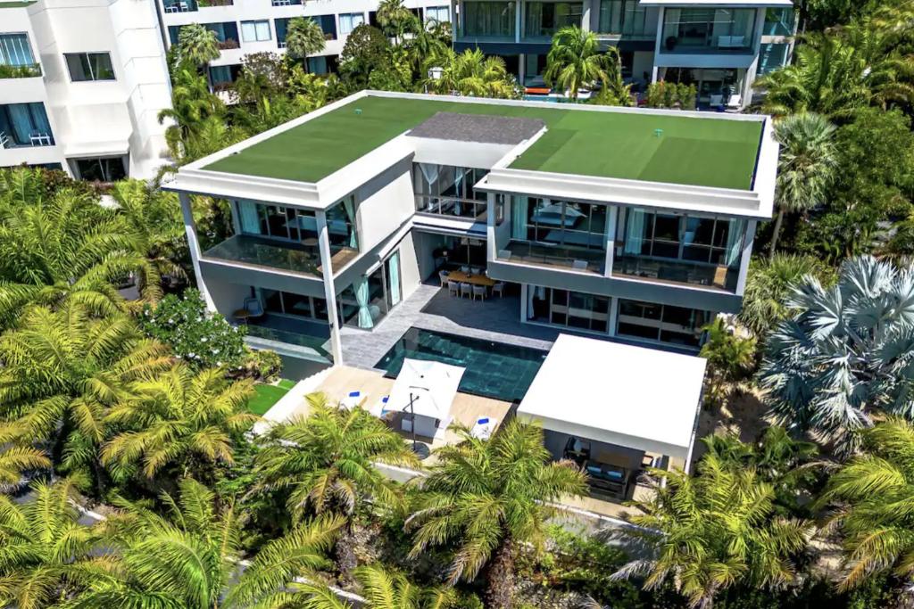 an aerial view of a house with palm trees at Villa Lion Phuket in Phuket