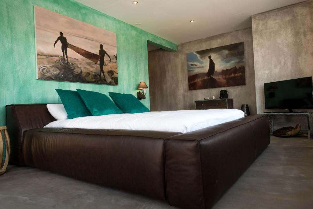 Postel nebo postele na pokoji v ubytování No1 Art B&B