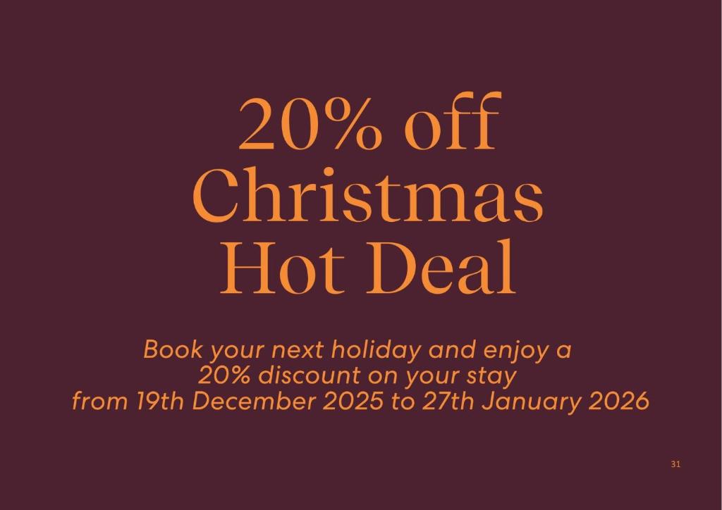 een flyer voor een kerstaanbieding met oranje tekst bij Cloud Nine, 18 Wynne Cres - heated pool, waterviews, beach in Corlette