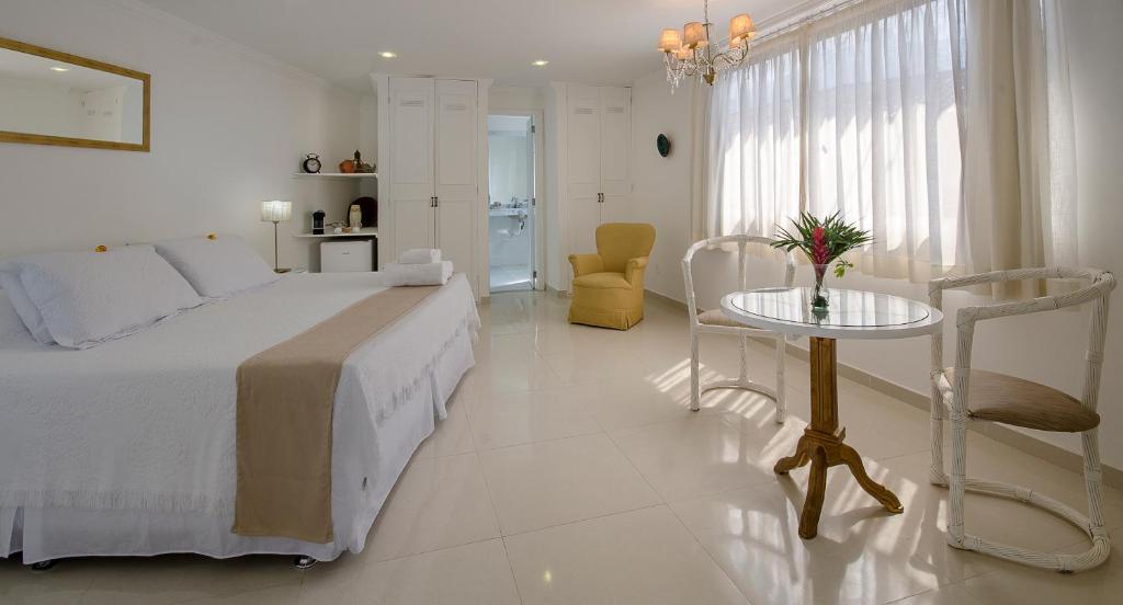 Cama ou camas em um quarto em Angra Boutique Hotel