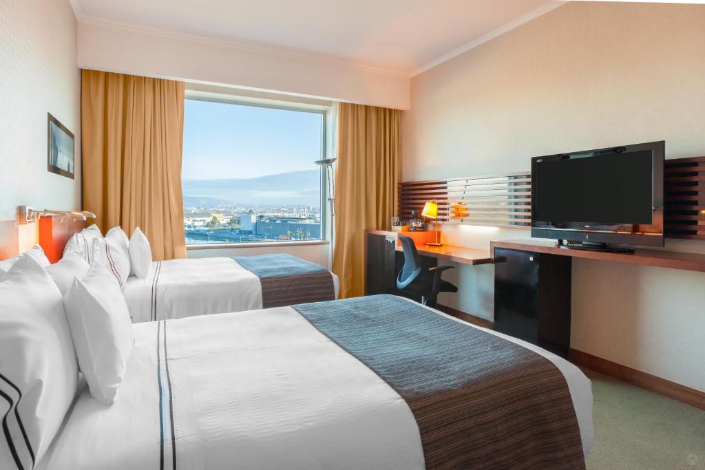 Una cama o camas en una habitación de MDS Hotel Concepción