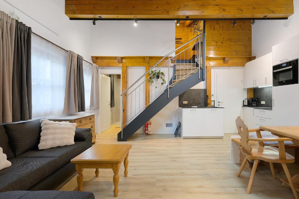 a living room with a couch and a table at Goodlife B10 in Saalbach-Hinterglemm
