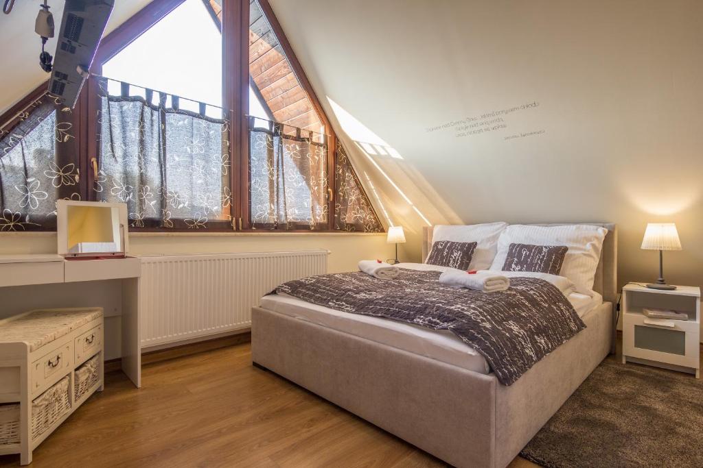 Posteľ alebo postele v izbe v ubytovaní Apartamenty Oaza Deluxe Zakopane