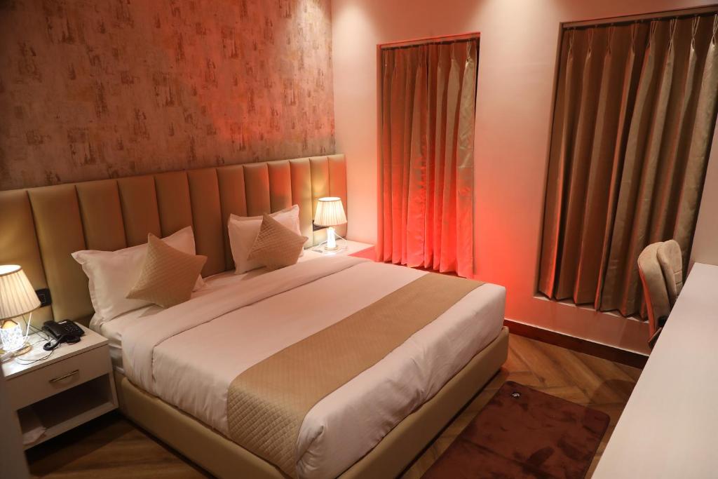 Ένα ή περισσότερα κρεβάτια σε δωμάτιο στο B Dot