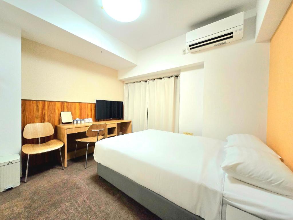 En eller flere senge i et værelse på 嵐 Arashi BNB 大国町 No8113