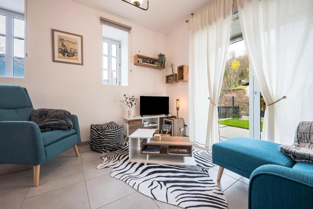 Et tv og/eller underholdning på Location Appartement Les Ondes